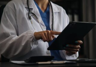 Female doctor using tablet
